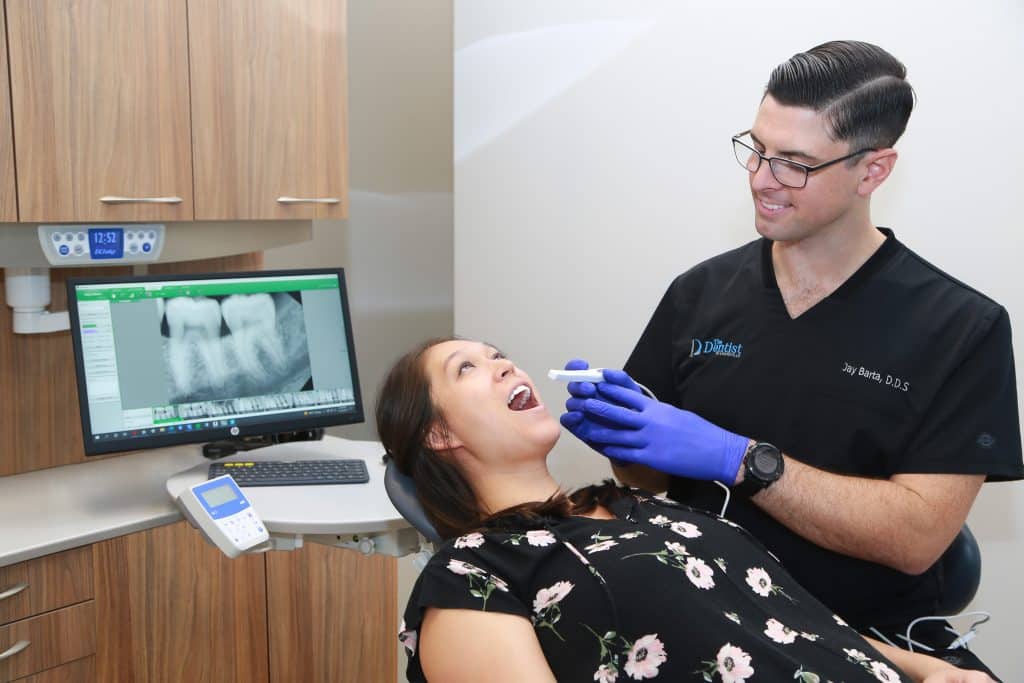 woman smiling in a dental chair