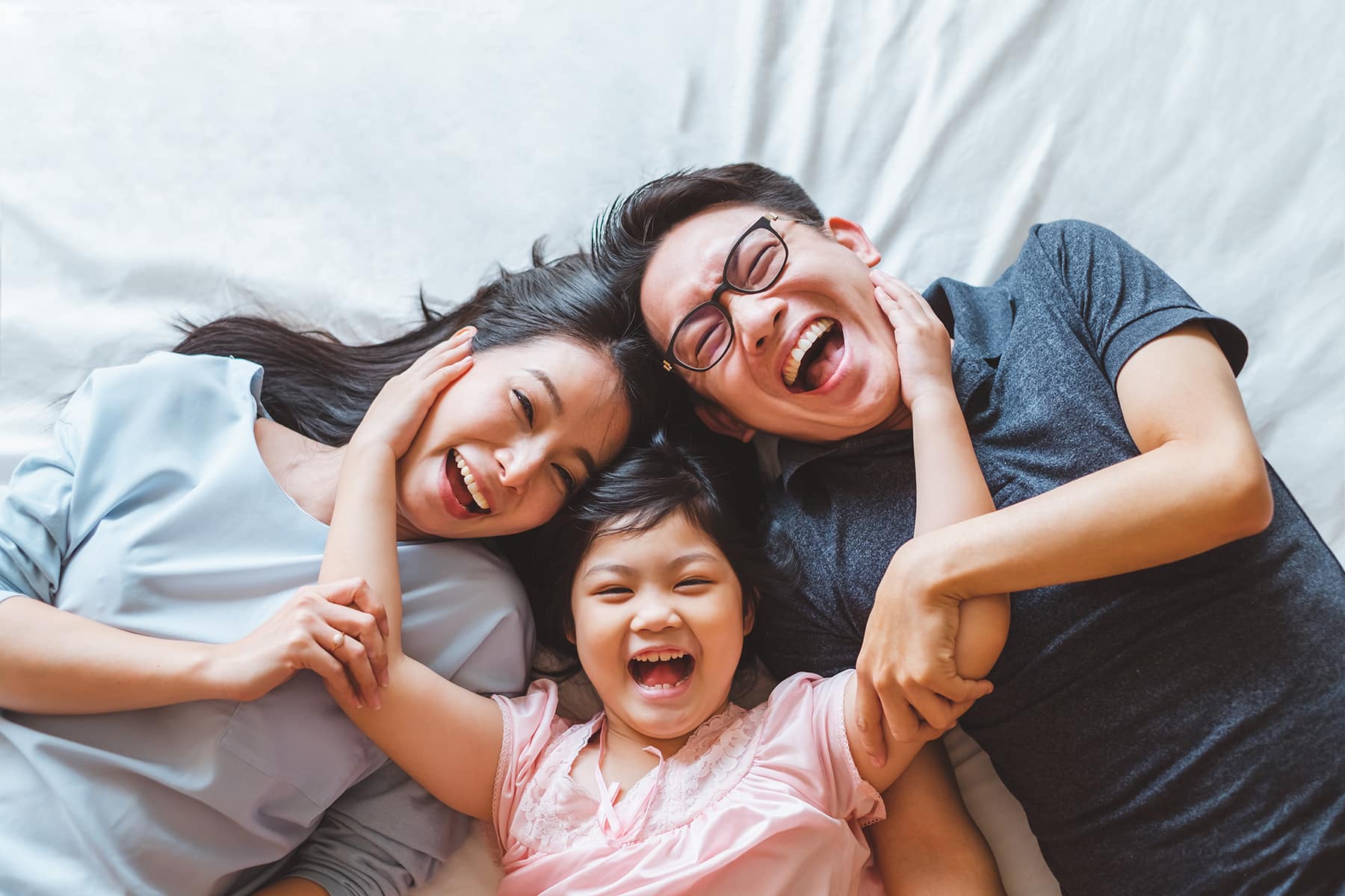 family smiling and hugging Dentist in Louisville in Louisville, CO