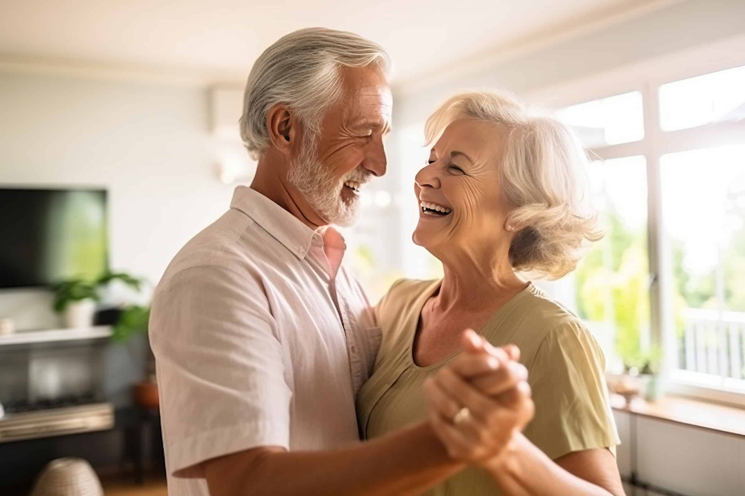 Older couple smiling with new implant dentures in Louisville, CO