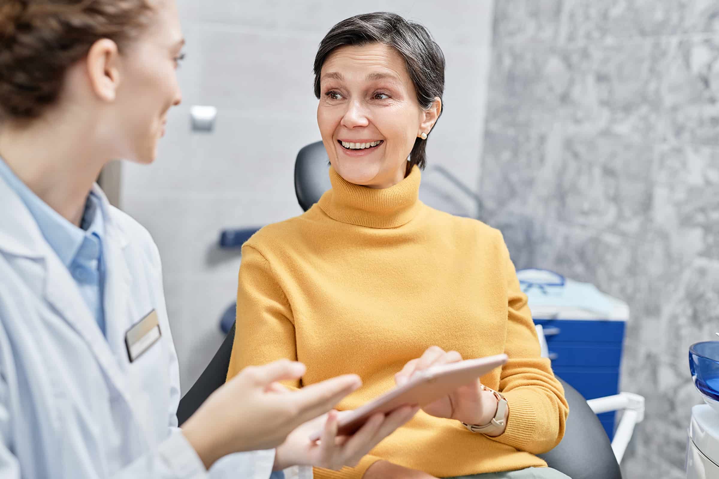 Woman getting an implant denture consultation in Louisville, CO