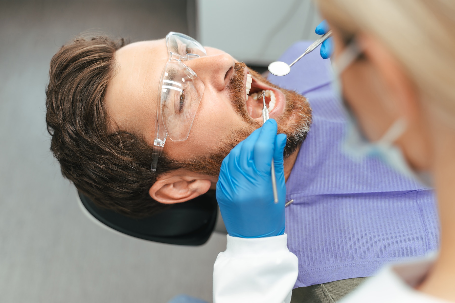 Man getting a dental filling treatment in Louisville, CO