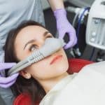 woman under sedation dentistry in Louisville KY