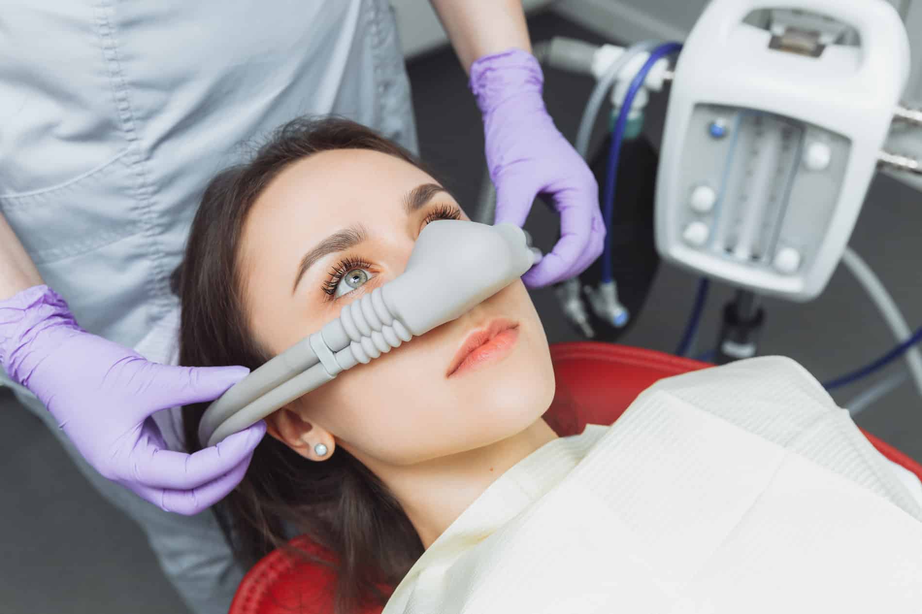 woman under sedation dentistry in Louisville KY