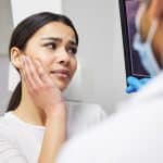 dental patient talking with Dr. Jay Barta in Louisville, CO during a dental emergency