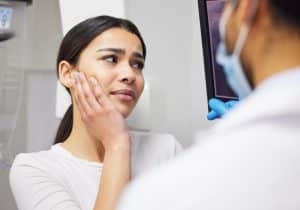 dental patient talking with Dr. Jay Barta in Louisville, CO during a dental emergency