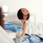 Dr Barta consulting with adental patient about cosmetic veneers at The Dentist in Louisville