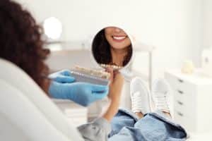 Dr Barta consulting with adental patient about cosmetic veneers at The Dentist in Louisville