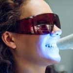 Woman getting treatment for stained teeth in Louisville, CO