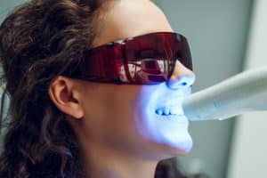 Woman getting treatment for stained teeth in Louisville, CO