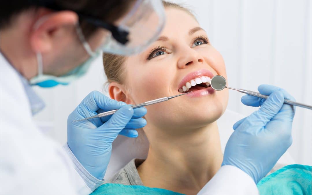 Patient receiving treatment for chipped tooth from The Dentist in Louisville in Louisville, CO