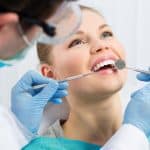 Patient receiving treatment for chipped tooth from The Dentist in Louisville in Louisville, CO