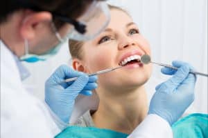 Patient receiving treatment for chipped tooth from The Dentist in Louisville in Louisville, CO