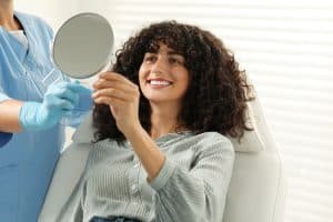 Woman getting dental whitening treatment in Louisville, CO